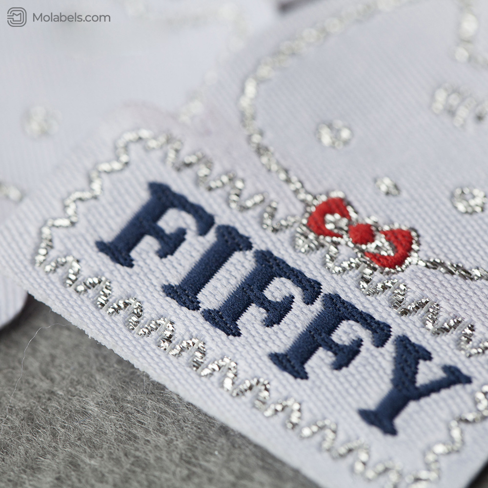 Custom embroidered clothing tags laser cut